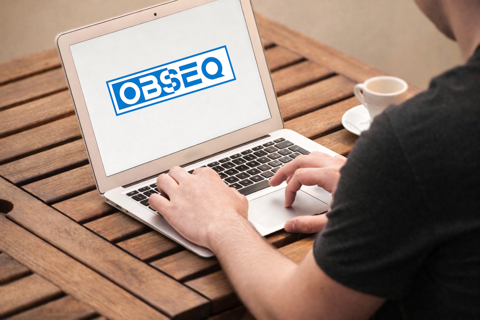 Laptop showing Obseq logo